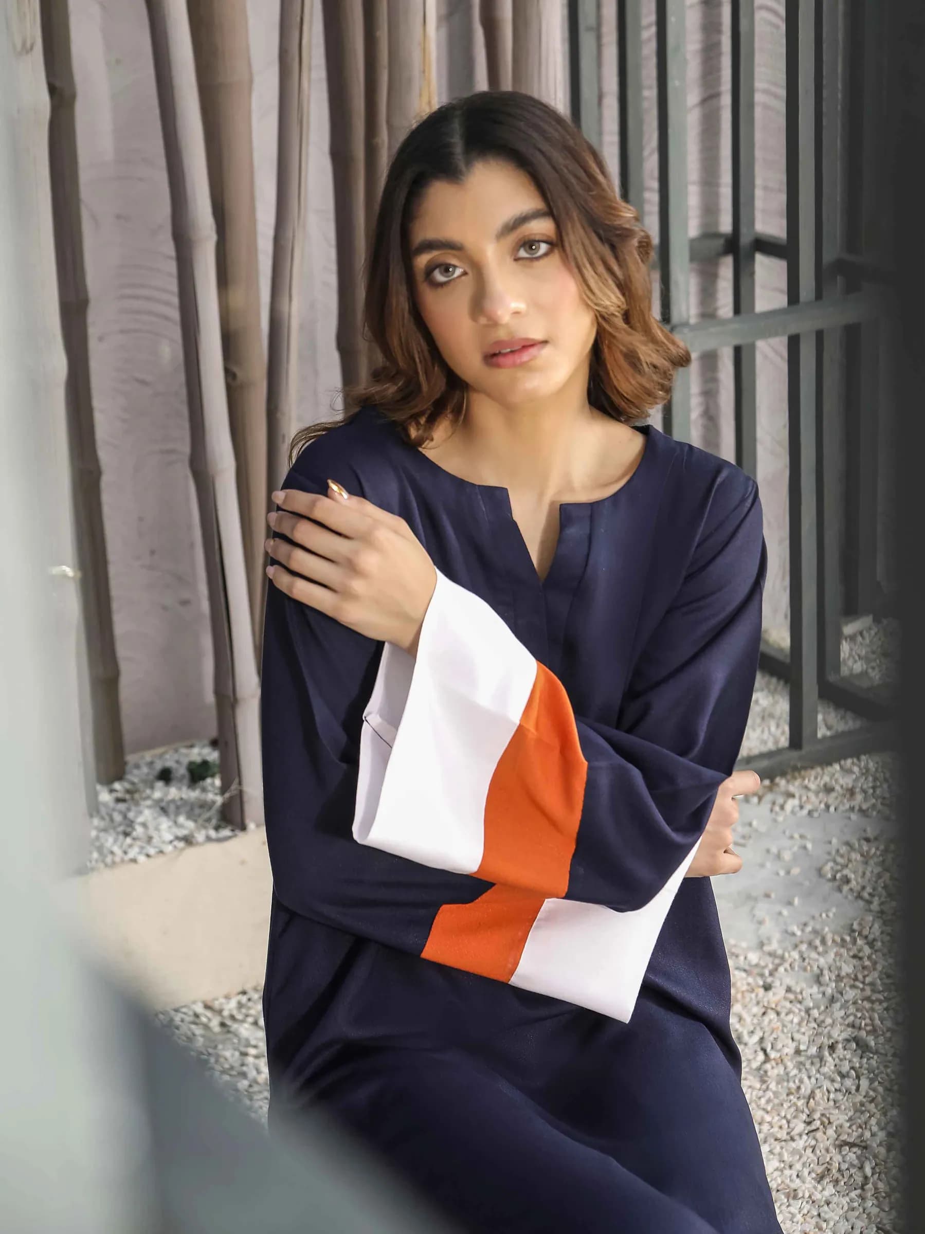 Model in a navy and white colour-block kurta