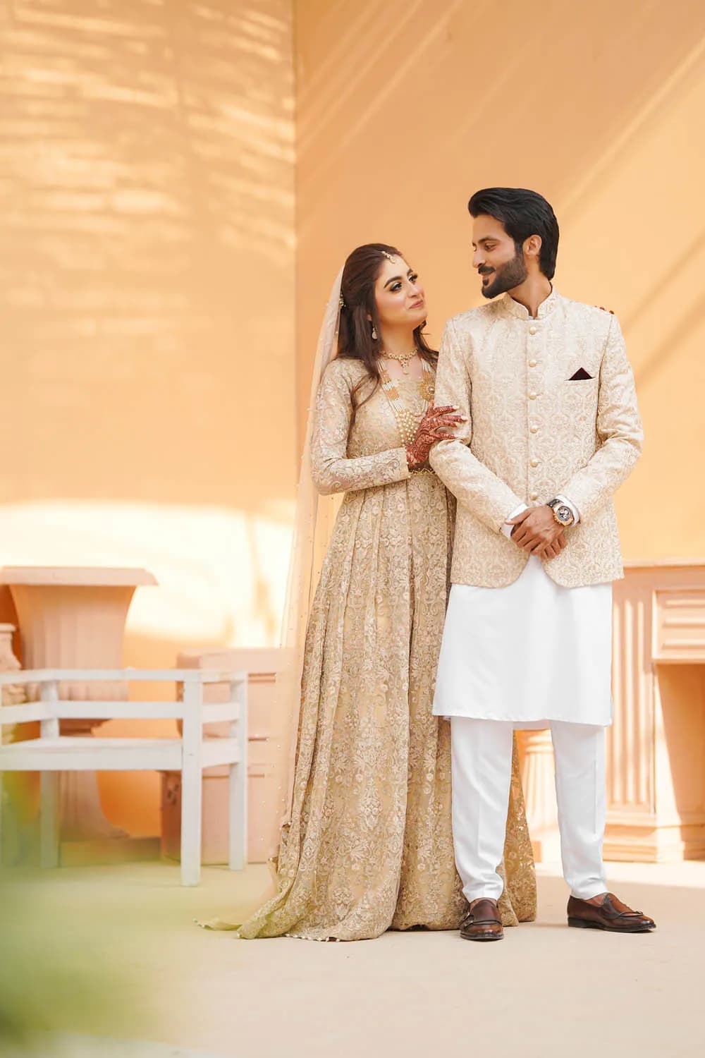Couple standing in warm golden light