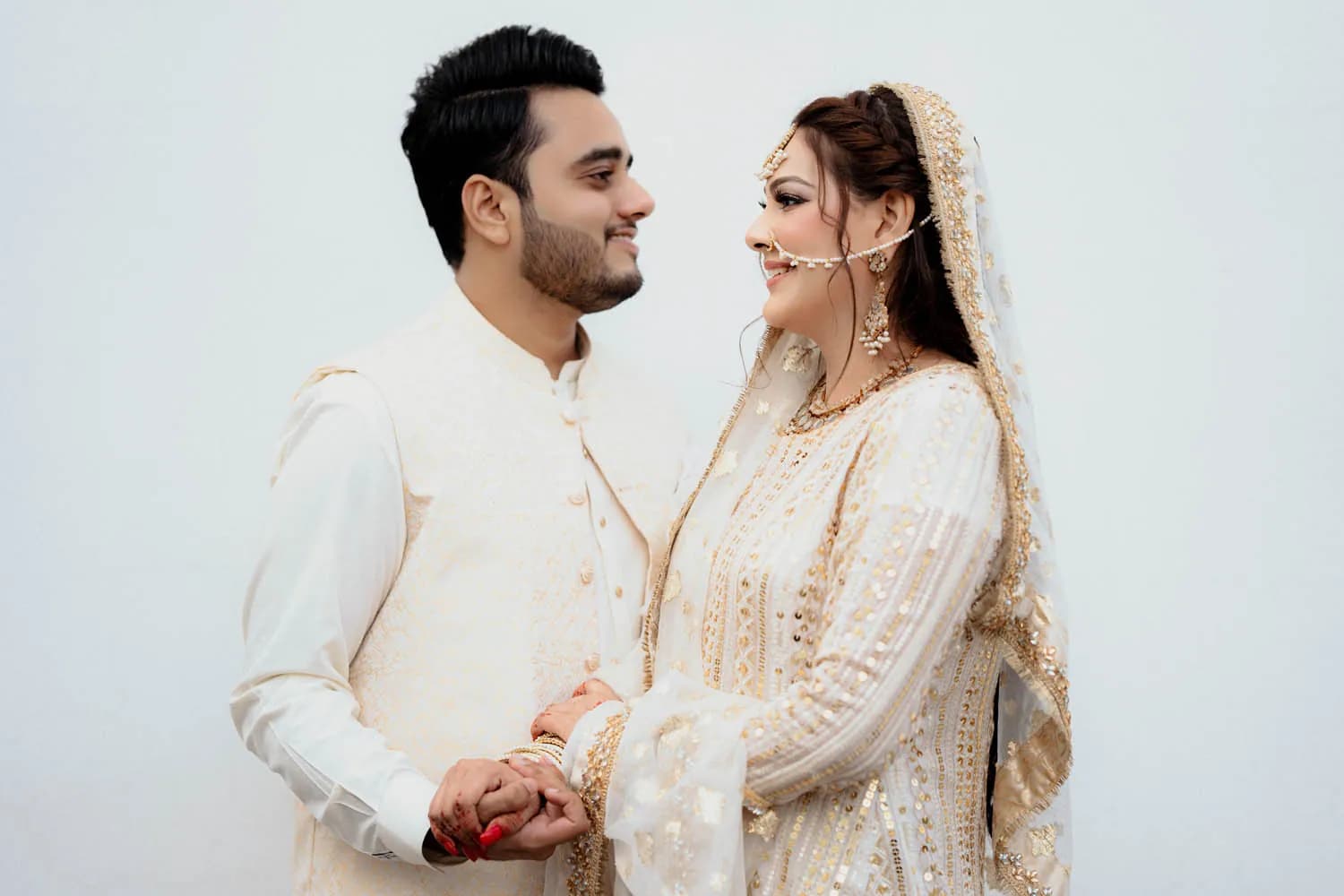 Couple in ivory sharing a quiet moment