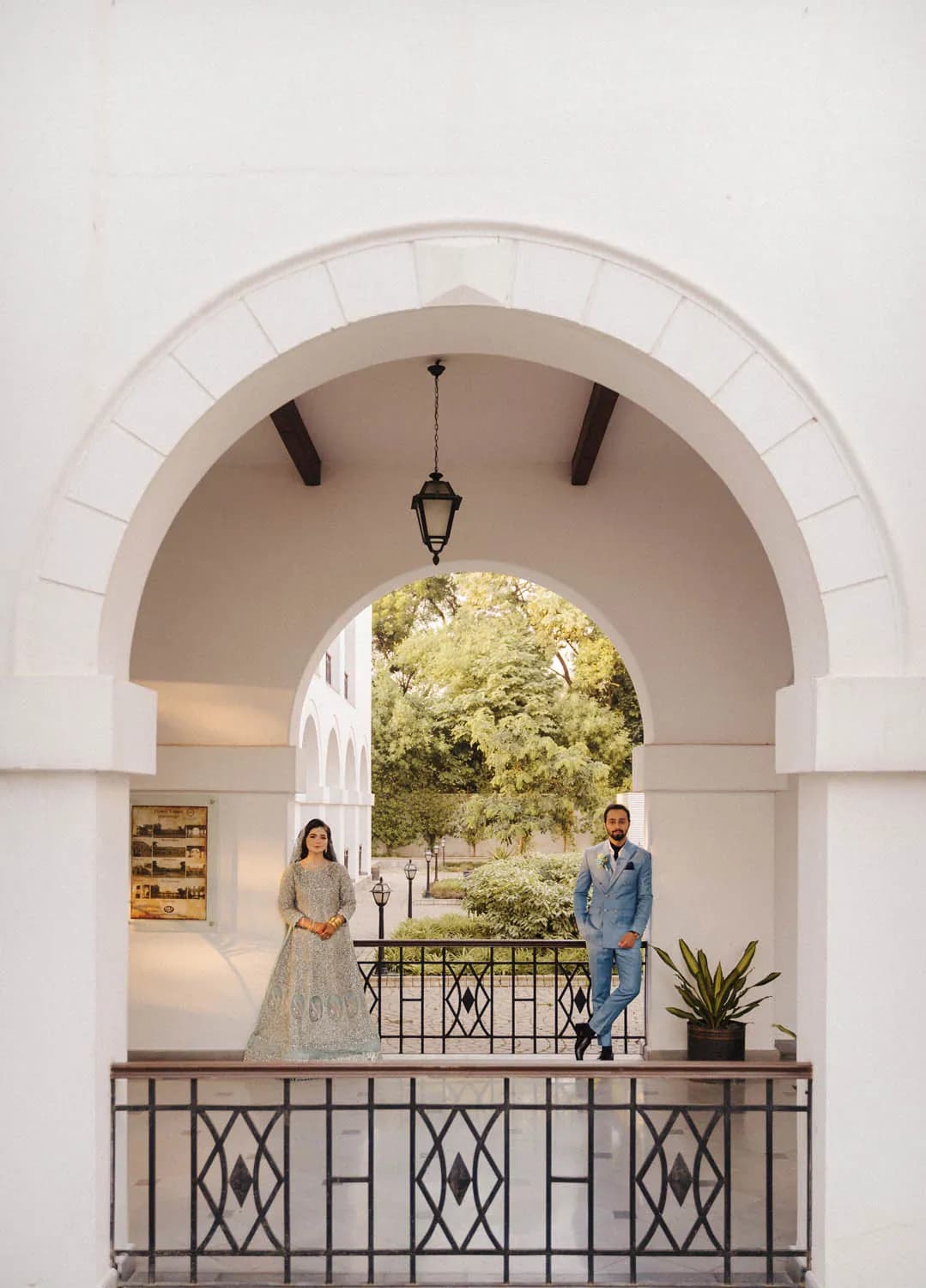 Couple framed by a white arch